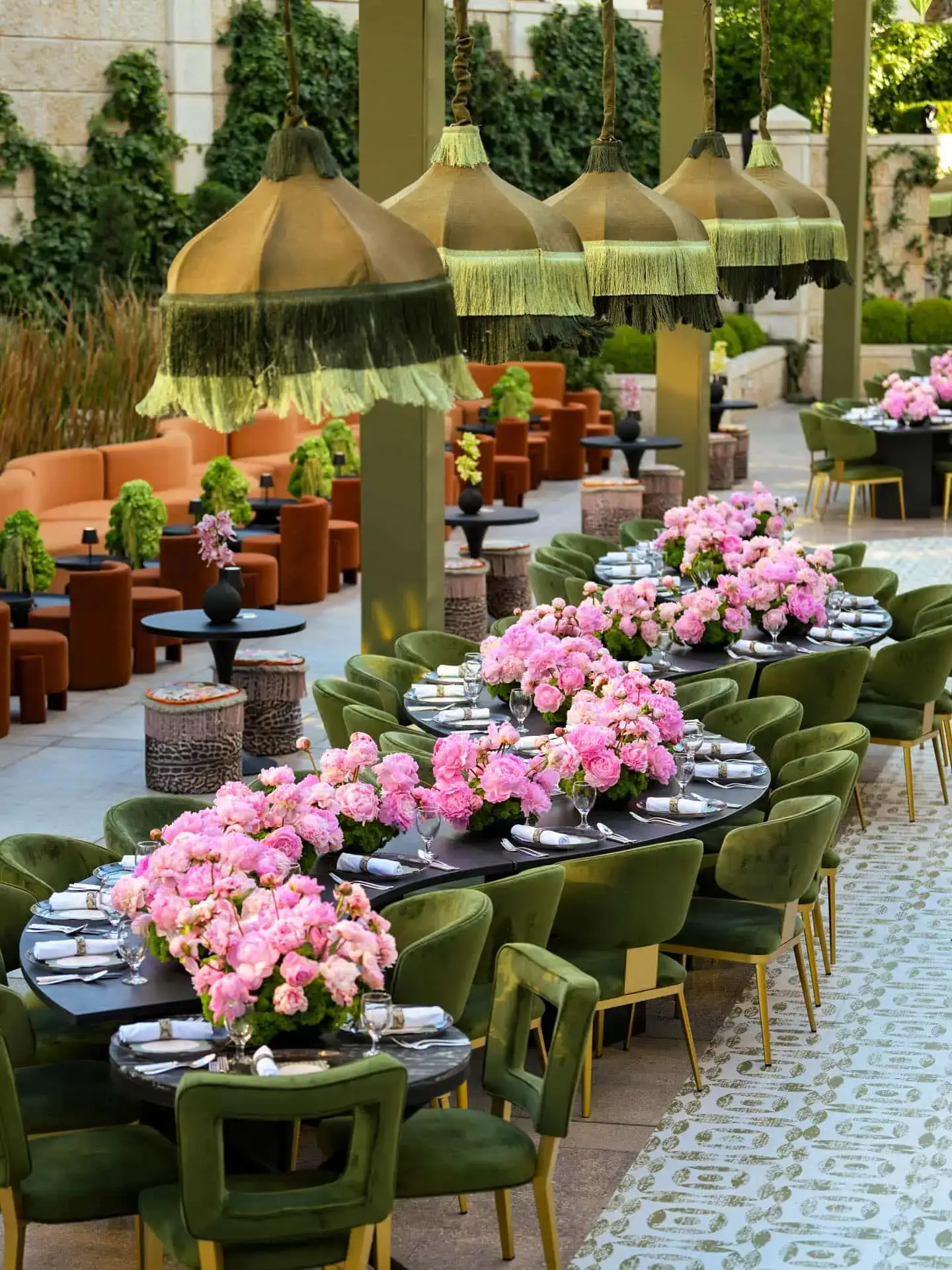 Luxurious wedding and event furniture setup with floral decor, featuring elegant chairs and tables.